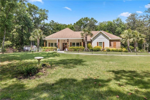 single story home featuring a front yard