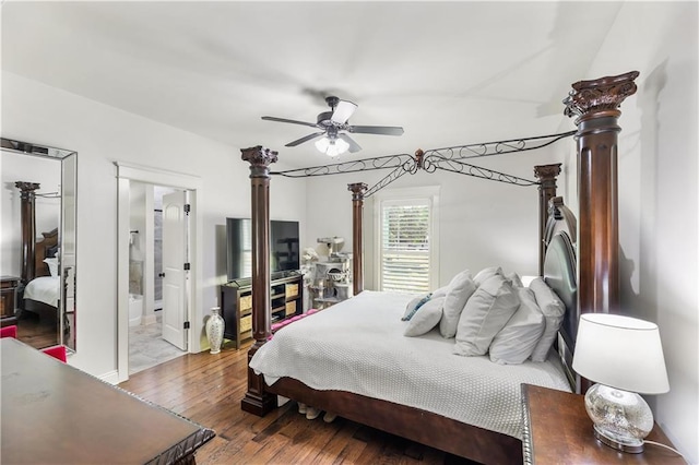 bedroom with wood finished floors, ensuite bathroom, and a ceiling fan