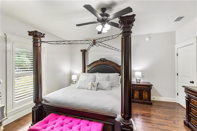 bedroom with visible vents, hardwood / wood-style floors, and baseboards