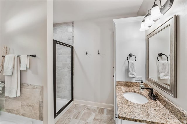 bathroom featuring a stall shower and vanity