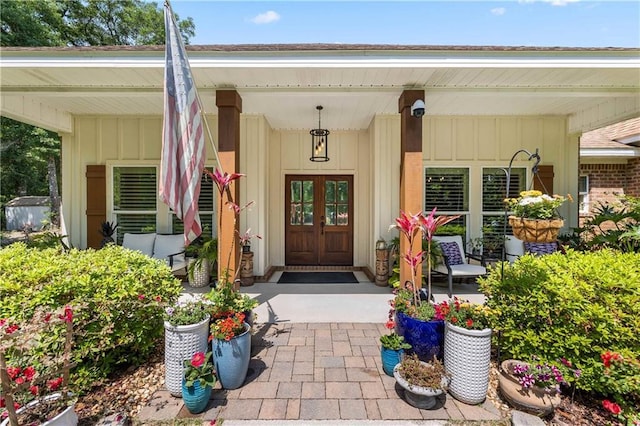 property entrance with a porch and board and batten siding