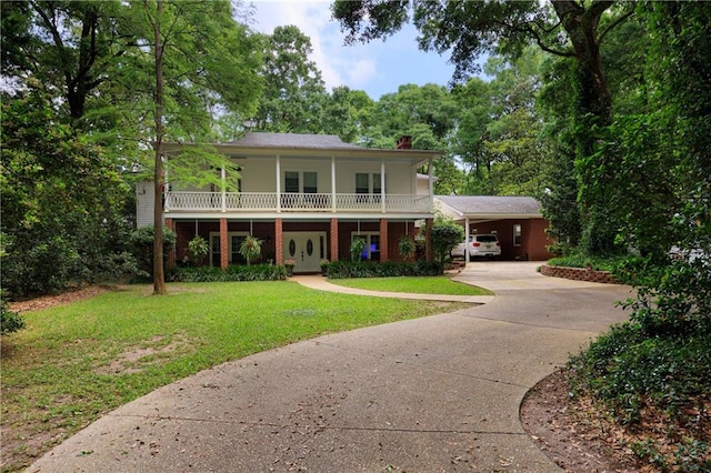 view of front of home featuring a front yard and covered porch