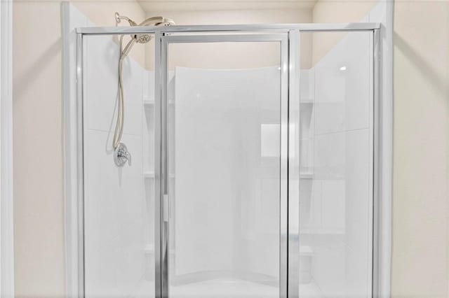 full bathroom featuring a stall shower