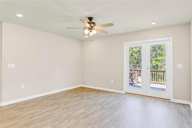 spare room with wood finished floors, ceiling fan, baseboards, and recessed lighting