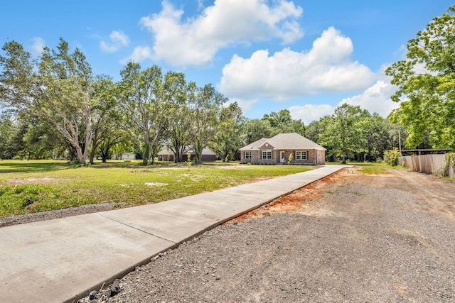21621 Coleman Cemetery Rd, Moss Point, MS 39562 - ranch-style home with gravel driveway