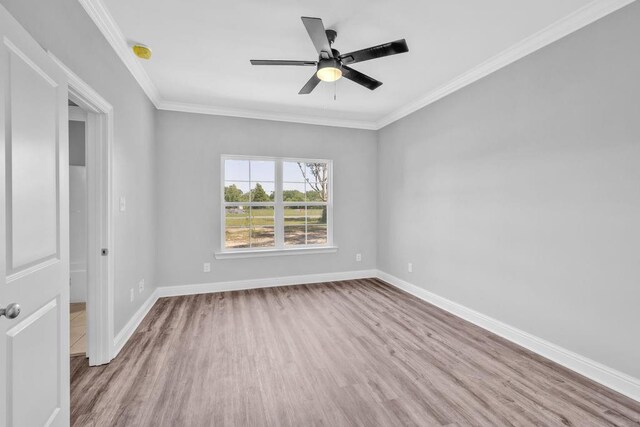 21621 Coleman Cemetery Rd, Moss Point, MS 39562 - unfurnished room featuring wood finished floors, baseboards, a ceiling fan, ornamental molding, and a smoke detector