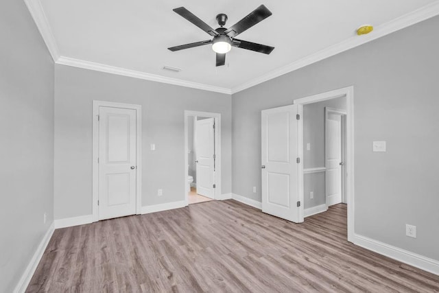 21621 Coleman Cemetery Rd, Moss Point, MS 39562 - unfurnished bedroom featuring ornamental molding, wood finished floors, baseboards, and ensuite bathroom