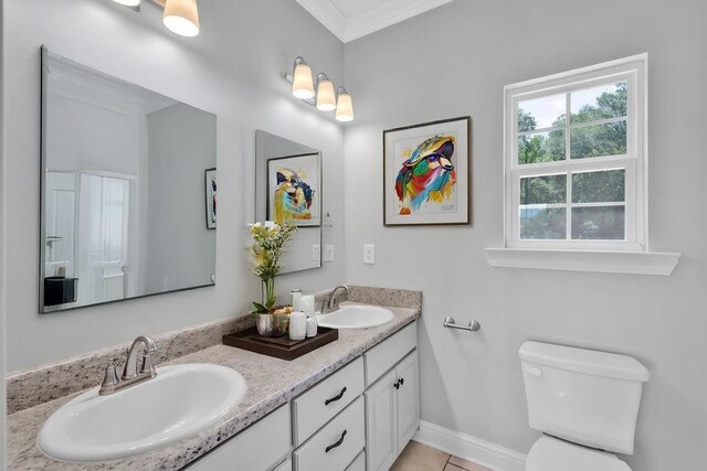 21621 Coleman Cemetery Rd, Moss Point, MS 39562 - full bathroom with ornamental molding, double vanity, baseboards, and toilet