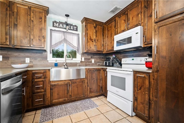 513 Samauri Ct, Saraland, AL 36571 - kitchen featuring white appliances, a sink, decorative backsplash, light tile patterned floors, and ornamental molding