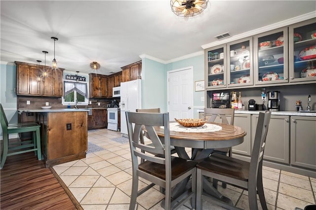 513 Samauri Ct, Saraland, AL 36571 - dining area featuring crown molding