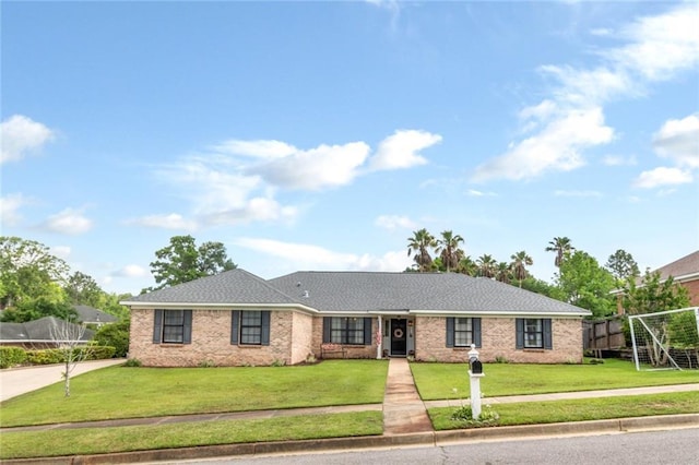7250 Pine Station Rd S, Mobile, AL 36695 - ranch-style home with concrete driveway and a front lawn