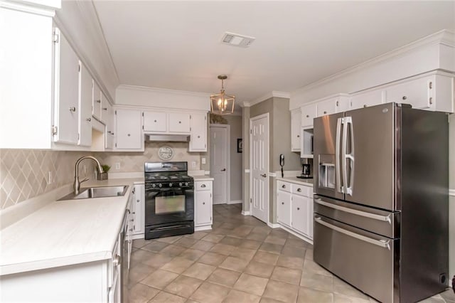 7250 Pine Station Rd S, Mobile, AL 36695 - kitchen featuring stainless steel appliances, a sink, light countertops, white cabinetry, and backsplash