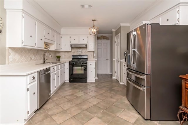 7250 Pine Station Rd S, Mobile, AL 36695 - kitchen featuring stainless steel appliances, a sink, light countertops, crown molding, and tasteful backsplash