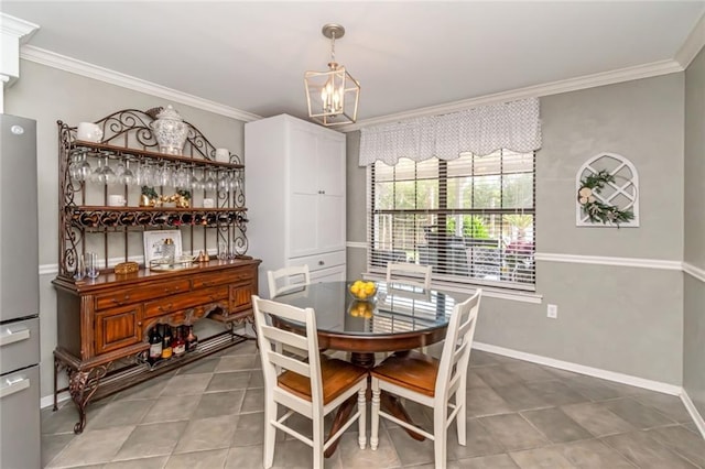 7250 Pine Station Rd S, Mobile, AL 36695 - dining area featuring ornamental molding, a chandelier, baseboards, and light tile patterned floors