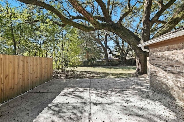 view of patio / terrace featuring fence