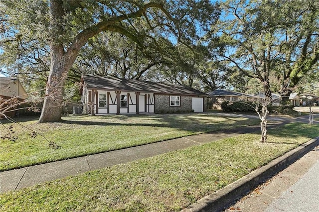 view of front of home with a garage and a front yard