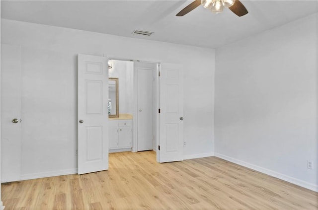 unfurnished bedroom with light wood-type flooring, visible vents, ceiling fan, and baseboards