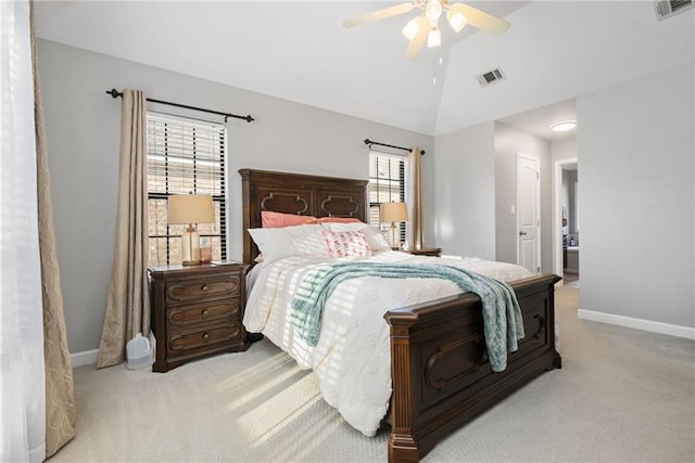 carpeted bedroom featuring vaulted ceiling, visible vents, and baseboards