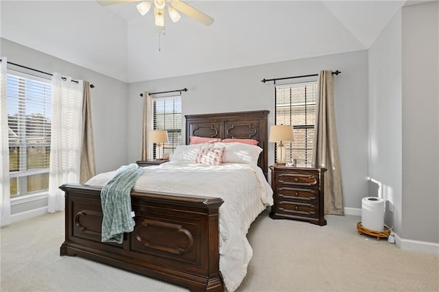 bedroom with lofted ceiling and multiple windows