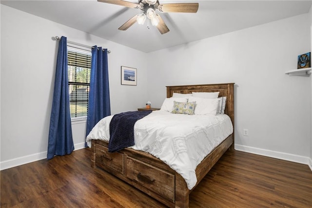 bedroom with ceiling fan, baseboards, and wood finished floors