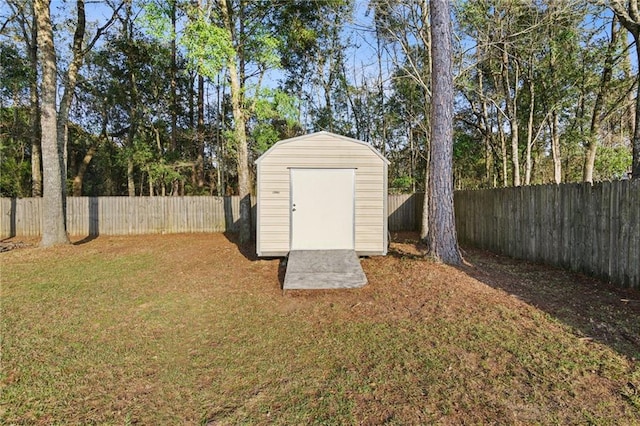 view of shed with a fenced backyard