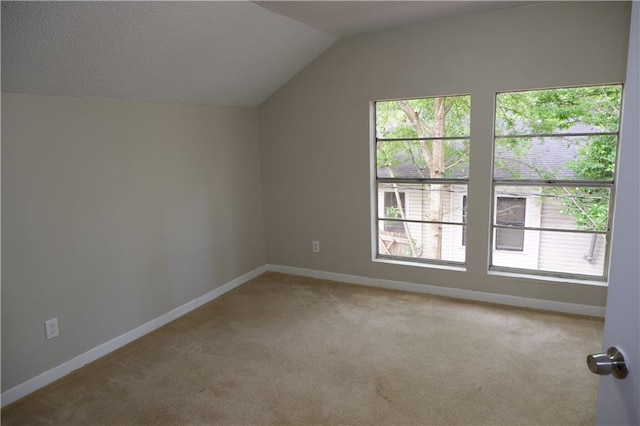 bonus room with carpet flooring and lofted ceiling