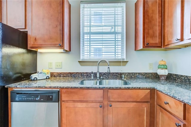 1430 Regency Rd Unit F204, Gulf Shores, AL 36542 - kitchen featuring stainless steel dishwasher, a sink, dark stone countertops, and brown cabinetry
