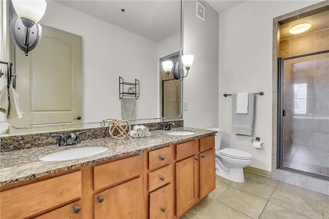1430 Regency Rd Unit F204, Gulf Shores, AL 36542 - full bathroom featuring tile patterned floors, a shower stall, toilet, double vanity, and baseboards