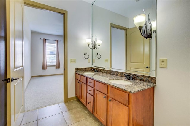 1430 Regency Rd Unit F204, Gulf Shores, AL 36542 - bathroom with double vanity, baseboards, and tile patterned floors