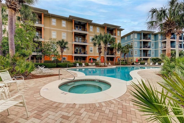 1430 Regency Rd Unit F204, Gulf Shores, AL 36542 - community pool with a community hot tub and a patio area