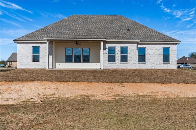 rear view of house with ceiling fan