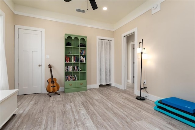 interior space with light wood finished floors, baseboards, visible vents, and recessed lighting