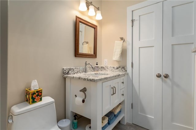 bathroom with vanity and toilet