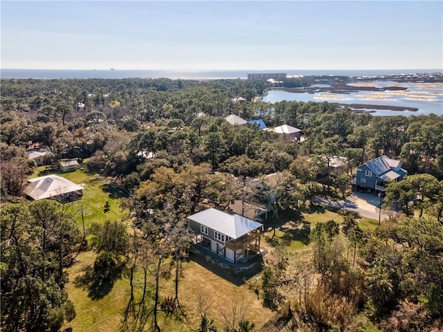 drone / aerial view featuring a wooded view