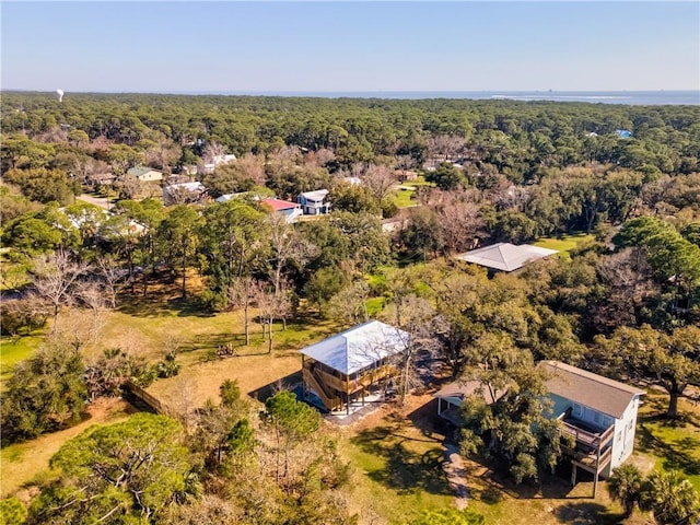 aerial view featuring a wooded view