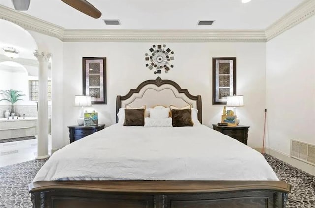 bedroom featuring ornamental molding, ensuite bathroom, and visible vents