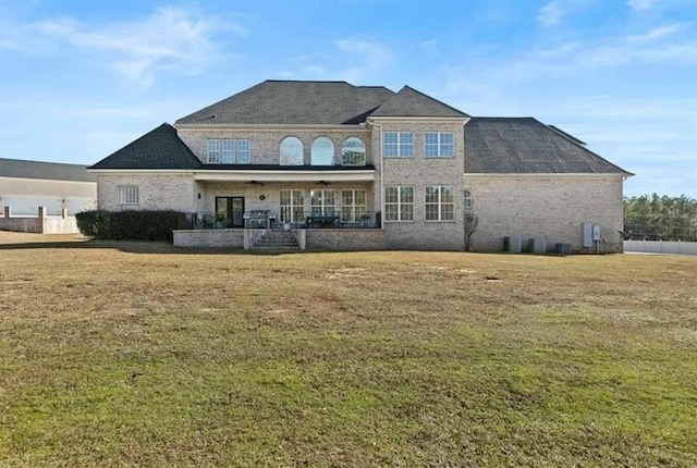 back of property with a yard