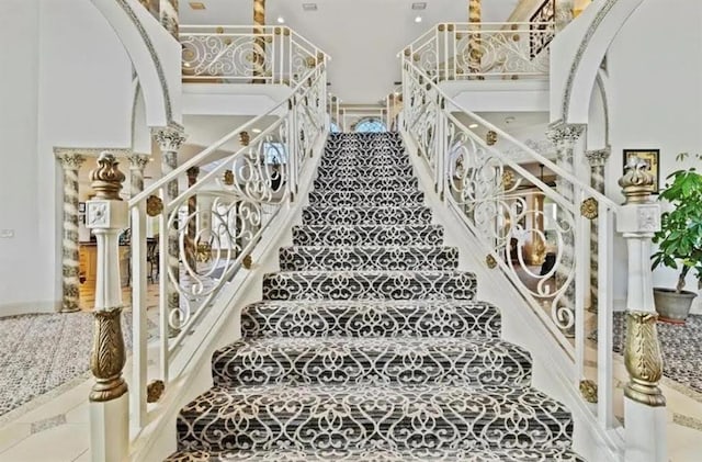 stairway featuring tile patterned flooring