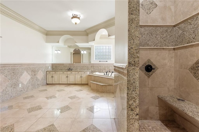 full bath with tile patterned floors, crown molding, a walk in shower, a garden tub, and tile walls