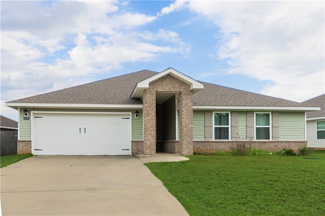 view of front of home with a garage and a front lawn