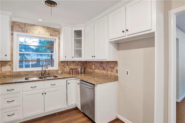 kitchen with stainless steel dishwasher, hardwood / wood-style floors, white cabinets, and light stone countertops