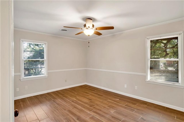 unfurnished room featuring ceiling fan, ornamental molding, and hardwood / wood-style floors