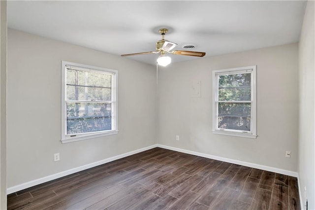 unfurnished room with ceiling fan and dark hardwood / wood-style flooring