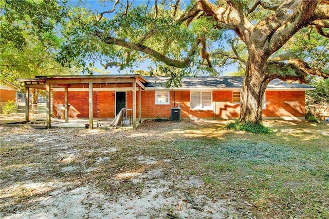 rear view of property featuring a patio area and central AC unit