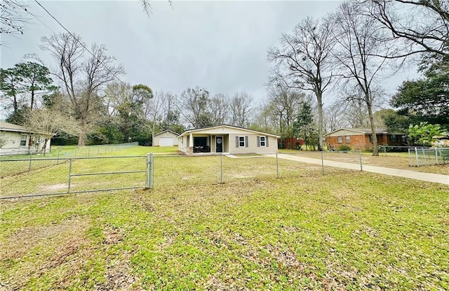 view of front facade featuring fence private yard, a front yard, and a gate