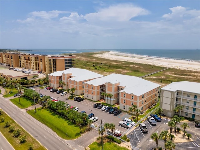 aerial view featuring a view of the beach and a water view