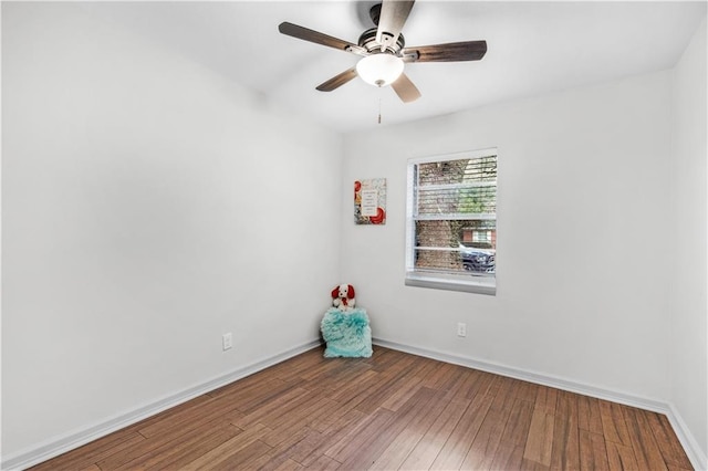 spare room featuring hardwood / wood-style flooring and ceiling fan