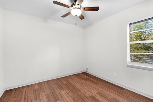 spare room with ceiling fan and hardwood / wood-style floors