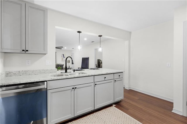 kitchen with stainless steel dishwasher, gray cabinets, dark hardwood / wood-style flooring, and sink