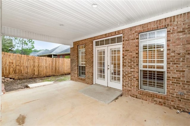 view of patio / terrace with french doors and fence